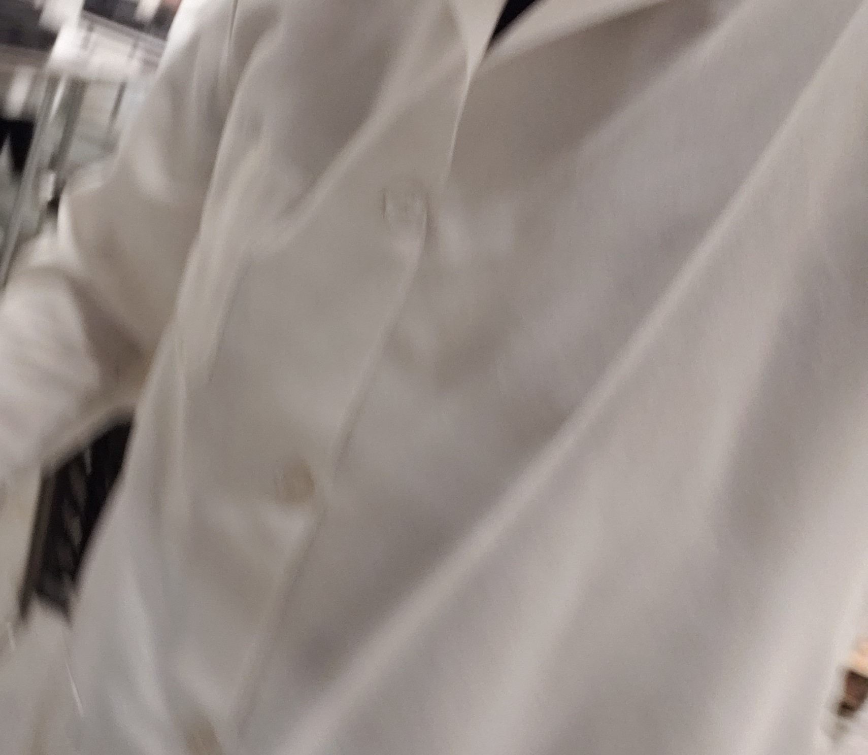 Person wearing a lab coat.
